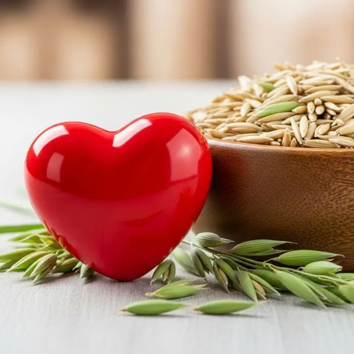 Heart symbol with oats showing  heart health benefits and lower cholesterol.